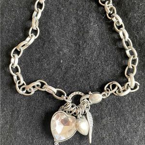 Silver color necklace.
